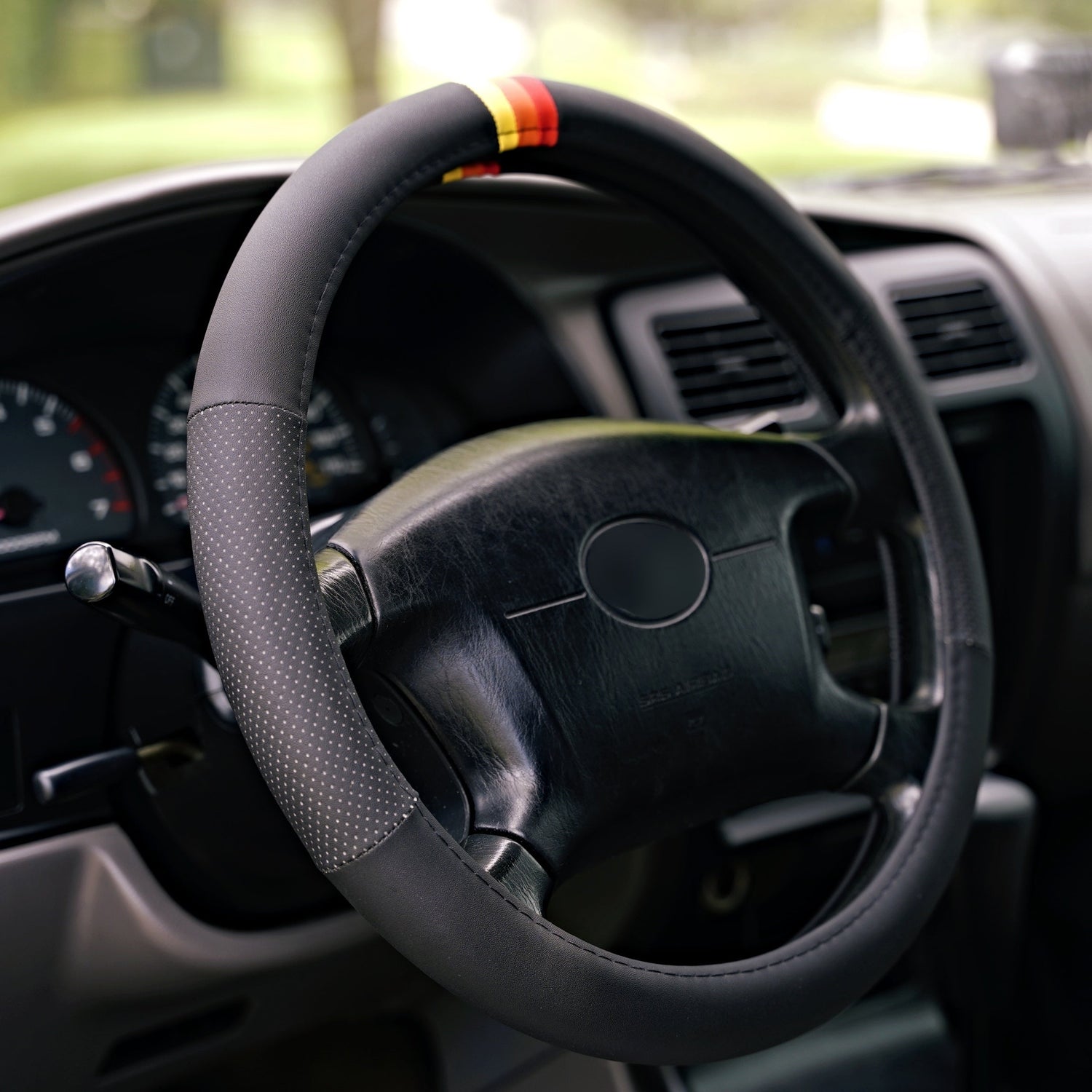 trd style tri-color retro stripes steering wheel cover installed on toyota 4runner